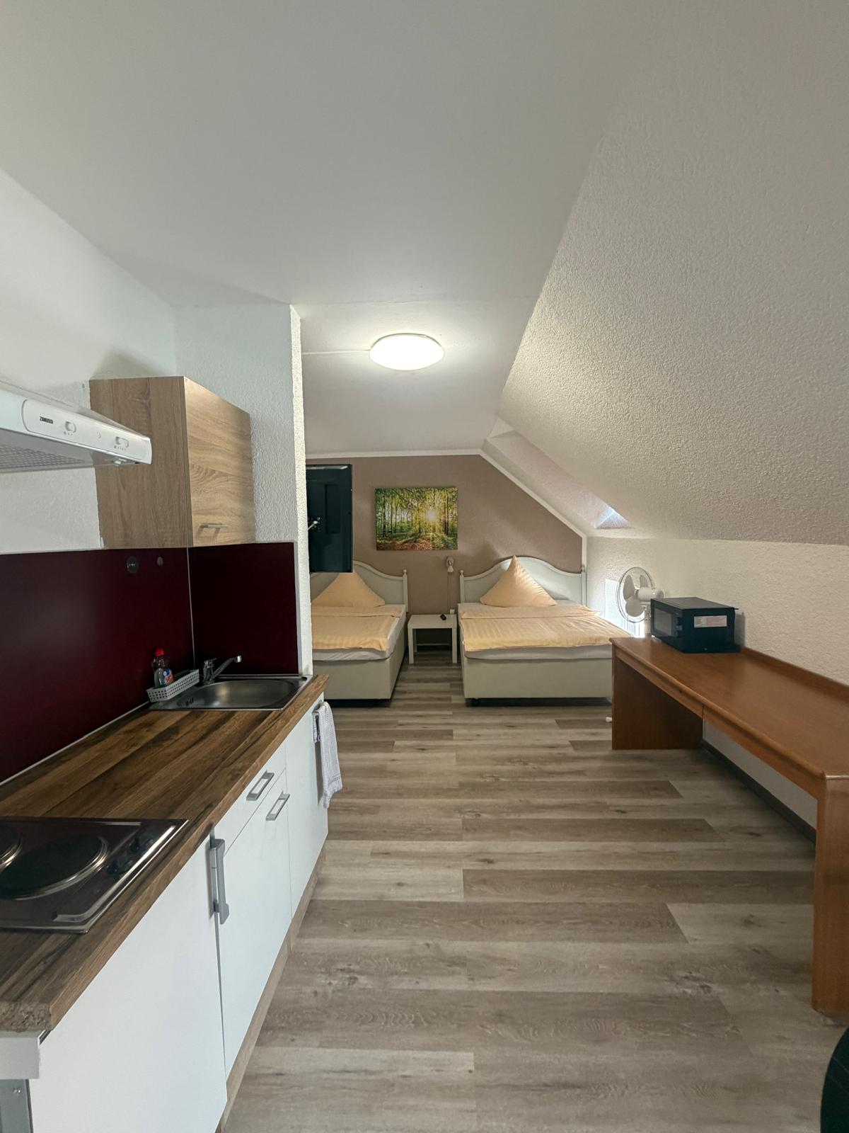 Long-stay room with single beds at Hotel Weller in Riedstadt