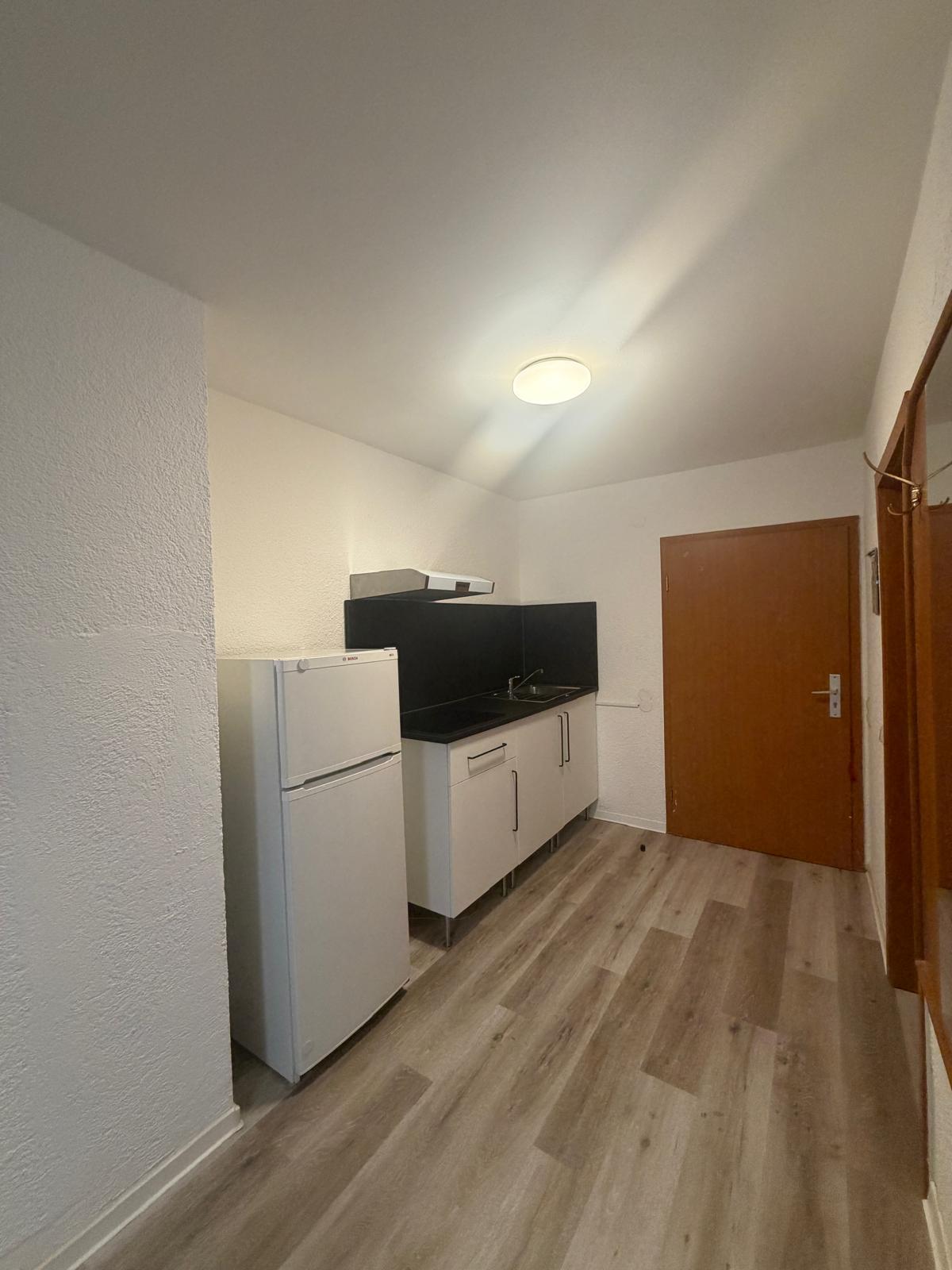 Kitchenette with fridge in the contractor room at Hotel Weller Riedstadt