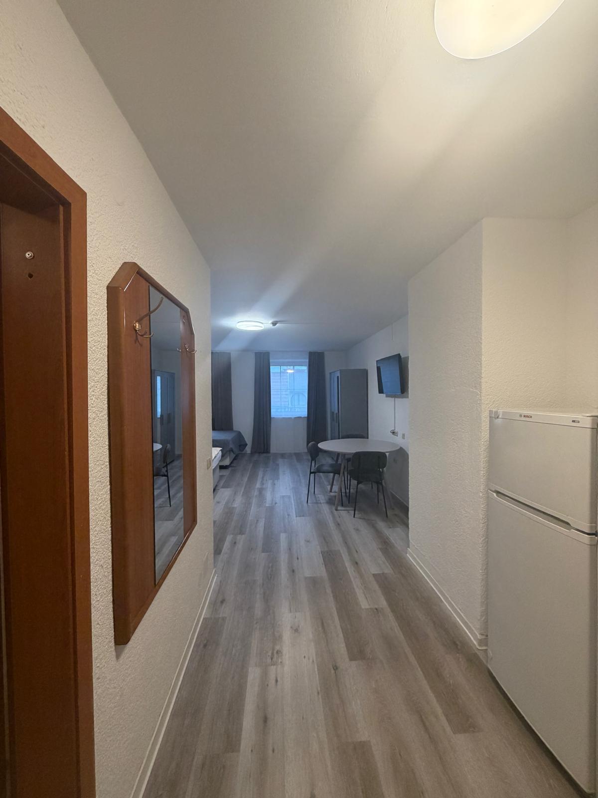 Apartment with kitchenette and dining table at Hotel Weller Riedstadt